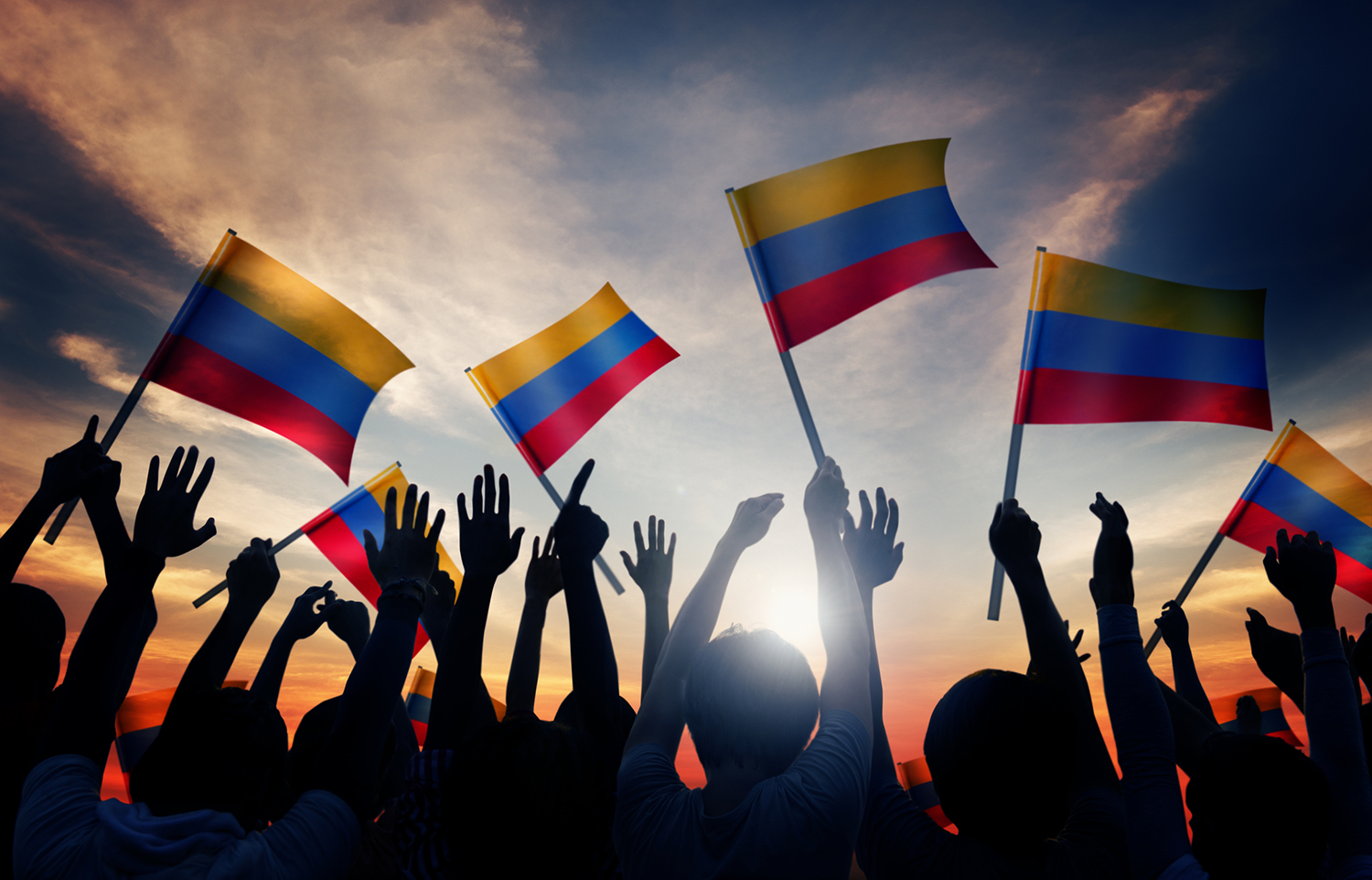 People raise many flags of Colombia in support of building a culture of peace. 