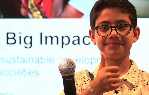 Rehan Bigzad gives thumbs up at "Small Asks for BIG Impact" HLPF2019 event. Photo by Erica Wong.