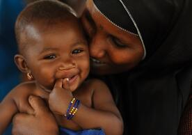 Six-month-old Maniratou Mahamadou, held by her mother, Habsatou Salou, smiles after a nutrition screening at the Boukoki Integrated Health Centre in Niamey, the capital of Niger. Permission © UNICEF/UNI122553/Quarmyne