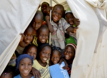 Nigerian school children show their support for UNICEFs PBEA program.