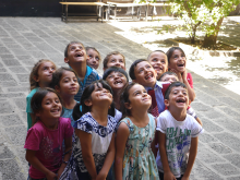 Happy Turkish school children look toward the sky and a brighter future.