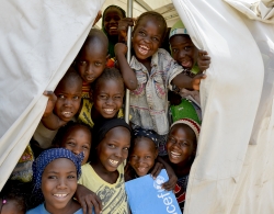 Nigerian school children show their support for UNICEFs PBEA program. © Courtesy UNICEF_UNI181989_Rich