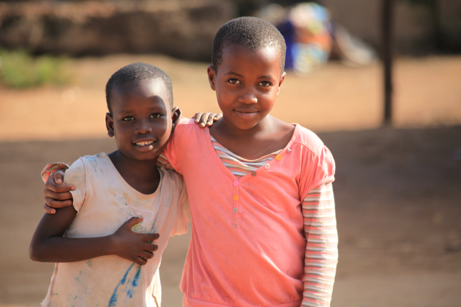 Two happy Ugandan school children participate in UNICEFs PBEA program.